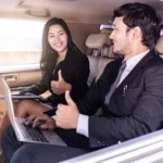 businessman-business-woman-sitting-thumbs-up-car-working-laptop
